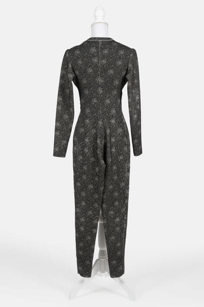 ALAIA
Form-fitting jumpsuit in black-and-white...