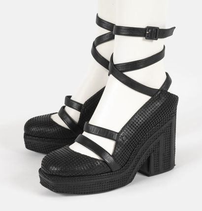 CHANEL
Pair of black leather platform sandals...