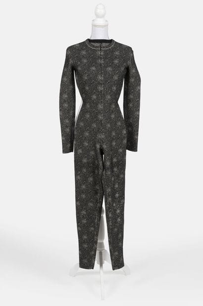 ALAIA
Form-fitting jumpsuit in black-and-white...