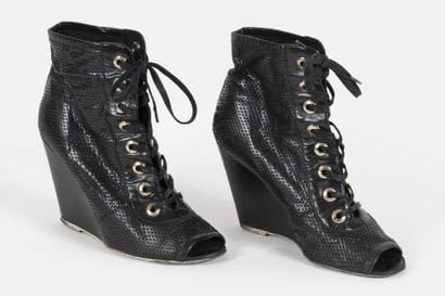 CHANEL
Pair of black braided leather high...
