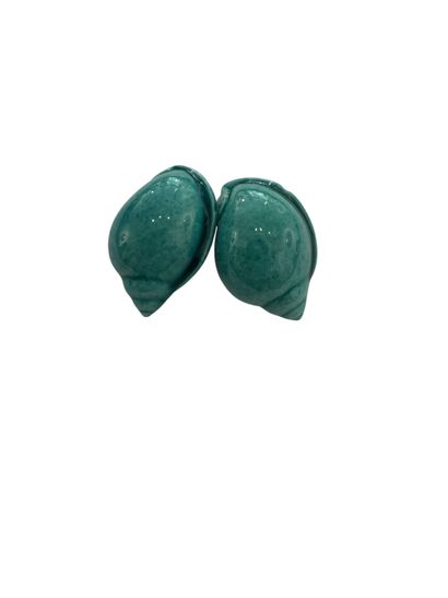 SHELL EAR CLIPS 
Two turquoise glazed earthenware...
