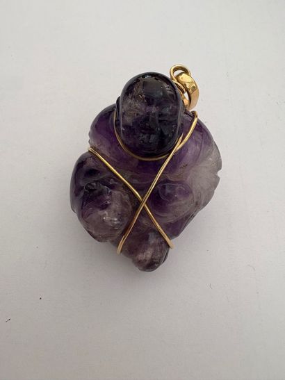PENDANT 
Buddha pendant in a block of amethyst...