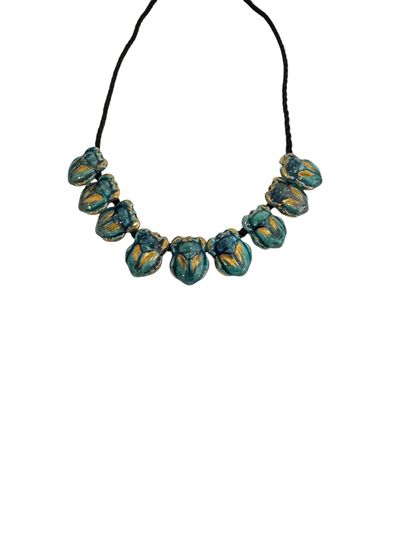 SCARABEES NECKLACE 
Necklace of 9 turquoise-glazed...