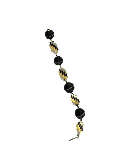 GOLD AND SARDONYX BRACELET
18k (750 thousandths)...