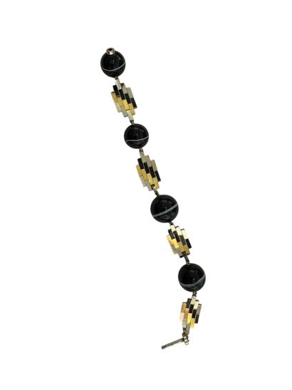 GOLD AND SARDONYX BRACELET
18k (750 thousandths)...