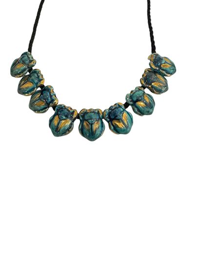 SCARABEES NECKLACE 
Necklace of 9 turquoise-glazed...