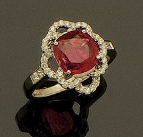 Bague en or gris 18K (750/oo) sertie d'un...