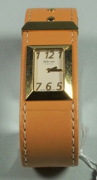 DINH VAN
Montre de dame en or jaune 18K (750/oo),...