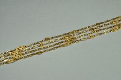 Long sautoir ancien en or jaune 18K (750/oo)...