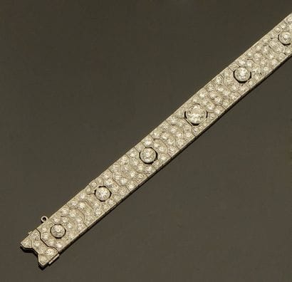 Bracelet ruban en or 18K (750/oo) et platine...