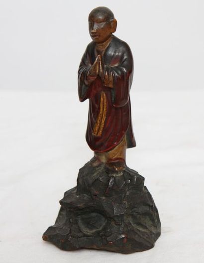 Taoist monk in adoration in lacquered wood...