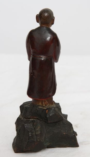 Taoist monk in adoration in lacquered wood...