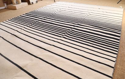 KILIM RUG with black stripes on a beige background

Modern...