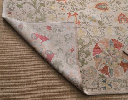HANDKNOTED EASTERN CARPET with Suzani decoration...