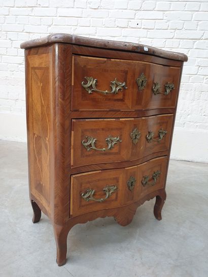 A SMALL RECTANGULAR CHEST OF DRAWERS, SLIGHTLY...