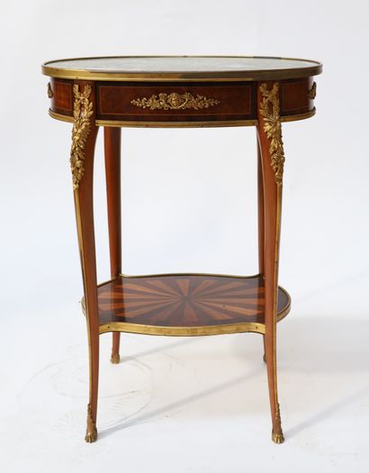 A small veneer middle table with an oval...