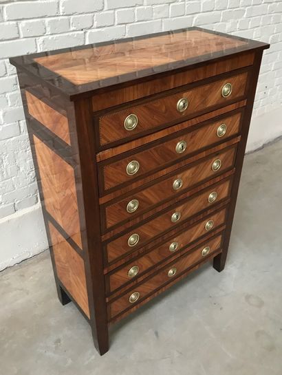 A LOUIS XVI CHIFFONIER IN ROSEWOOD AND AMARANTH...