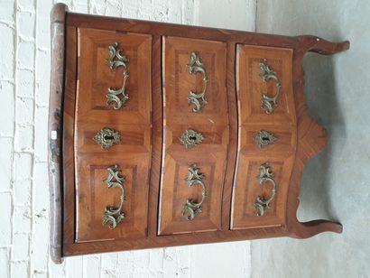 A SMALL RECTANGULAR CHEST OF DRAWERS, SLIGHTLY...