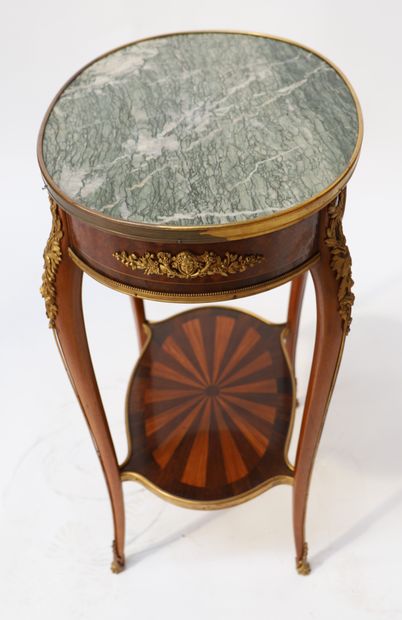 A small veneer middle table with an oval...