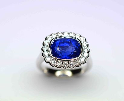 White gold ring set with a large cushion...