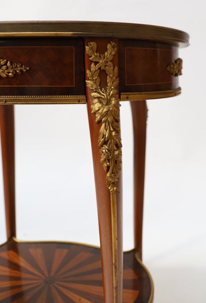 A small veneer middle table with an oval...