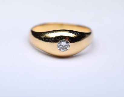 Yellow gold ring centered with a round modern...