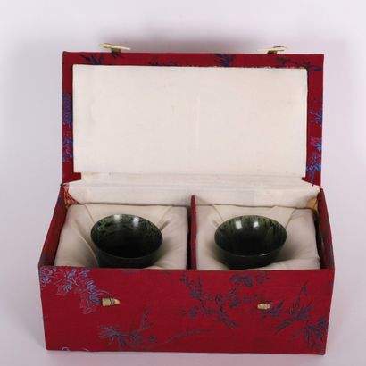 PAIR OF CHINESE GREEN JADE STONE TUMBLERS
In...