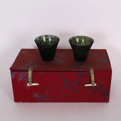 PAIR OF CHINESE GREEN JADE STONE TUMBLERS
In...