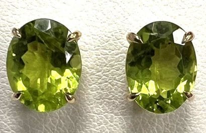 PAIR OF YELLOW GOLD EARRINGS SET WITH PERIDOTS
Pair...