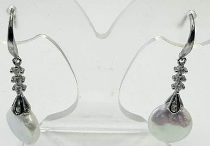 PAIR OF SILVER AND SILVER PLATED EARRINGS
Adorned...
