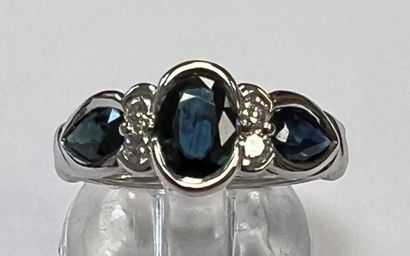 WHITE GOLD BAND RING SET WITH SAPPHIRES AND...