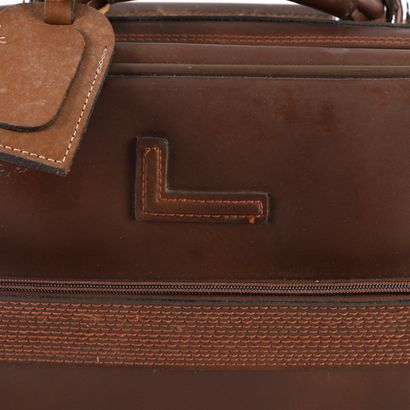 LANCEL CHOCOLATE LEATHER SUITCASE
Chocolate-colored...
