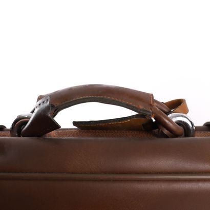 LANCEL CHOCOLATE LEATHER SUITCASE
Chocolate-colored...
