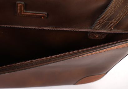 LANCEL CHOCOLATE LEATHER SUITCASE
Chocolate-colored...
