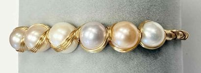 TWISTED GOLD-PLATED METAL BRACELET ADORNED...