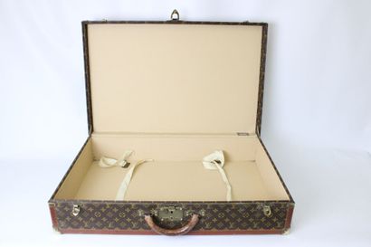 LOUIS VUITTON. Valise rigide Bisten en toile...