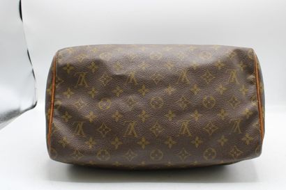 LOUIS VUITTON. Sac Speedy en toile monogramme...