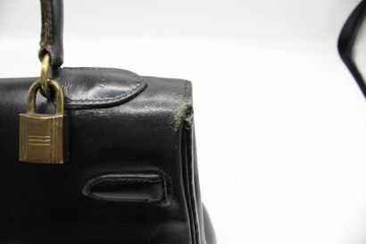 HERMES. Sac Kelly 32 retourné en cuir noir,...