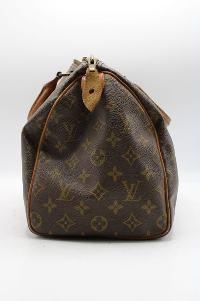 LOUIS VUITTON. Sac Speedy en toile monogramme...