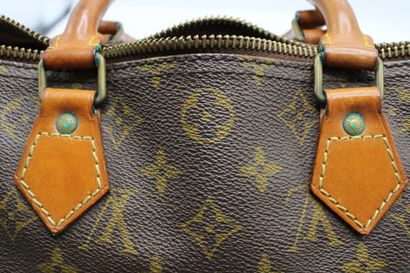 LOUIS VUITTON. Sac Speedy en toile monogramme...