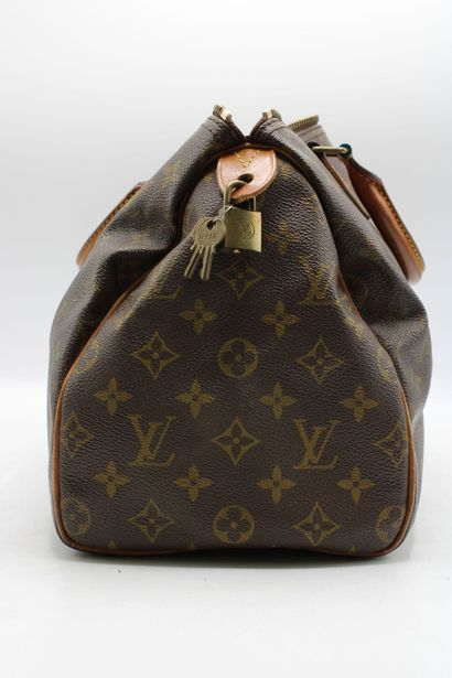 LOUIS VUITTON. Sac Speedy en toile monogramme...