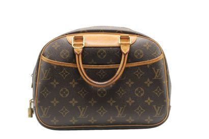 LOUIS VUITTON. Sac Deauville en toile monogramme...