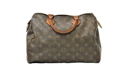 LOUIS VUITTON. Sac Speedy en toile monogramme...