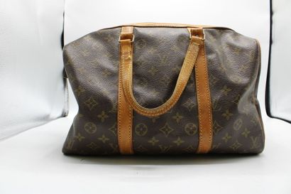 LOUIS VUITTON. Sac Keepall en toile monogramme...