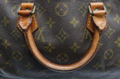LOUIS VUITTON. Sac Speedy en toile monogramme...