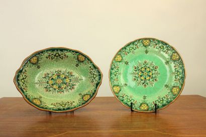 LONGWY. Plate and cup in enamelled earthenware...