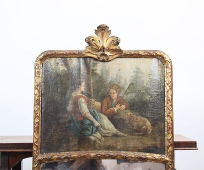 Trumeau en bois sculpté à décor d'une scène...