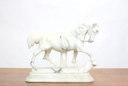 Cheval en albâtre sur son socle de même composition,...