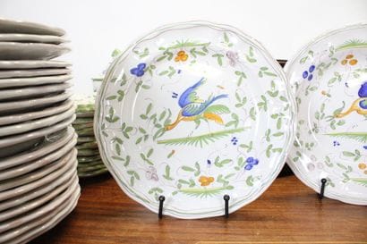 MOUSTIER. Earthenware service with polychrome...