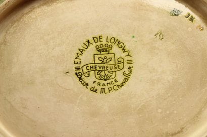 LONGWY. Plate and cup in enamelled earthenware...